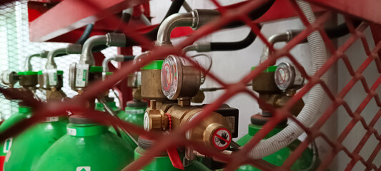 Fire suppression system tube in a cage
