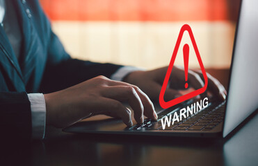 Business risk concept Notification on notebook screen to be cautious in investing, warning of...