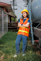 portrait train locomotive engineer women worker. Happy Asian young teen smiling work at train station train track locomotive service maintenance. - 794912815