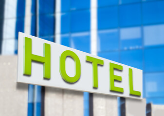 Hotel word with green letters on hotel at city