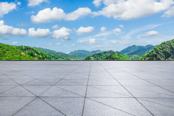 Empty square floor and green mountains with sky clouds natural background
