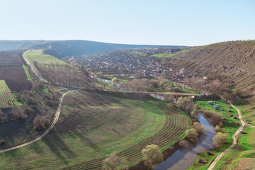 Aerial view of a small village on a hillside in spring. Aerial panorama of village Trebujeni in Moldova