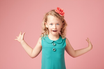 Female child, shocked and fashion with portrait, amazed and arms open by background. Young girl, surprised and wow in studio with dress, cute and omg expression for excitement in casual clothing