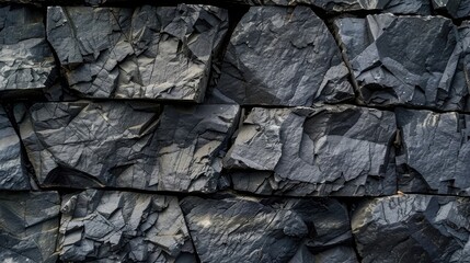 Rough dark grey slate stone wall texture background