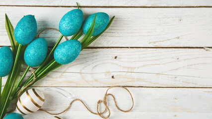 easter holiday card decorated easter eggs and easter's knick knack a wooden background - obrazy, fototapety, plakaty