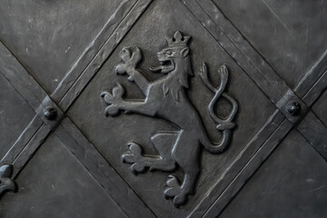 Reinforced door with some heraldic lion on it