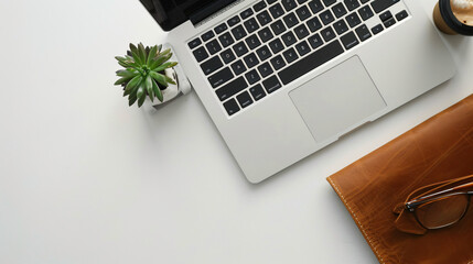 Laptop computer with softcase on white table.