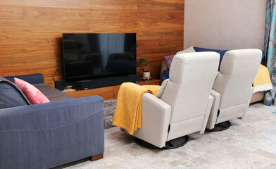 Home theater with reclining chairs. Contemporary furniture. 