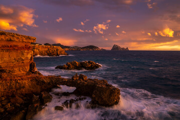 Fototapeta na wymiar Beautiful sunset at Cap des Bou cape, near Cala Comte beaches, Sant Josep de Sa Talaia, Ibiza, Balearic Islands, Spain