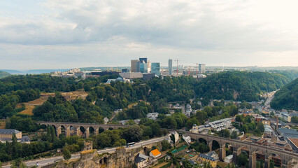Fototapeta na wymiar Luxembourg City, Luxembourg. Railway with bridges and arches. View of the Kirchberg area with modern houses, Aerial View