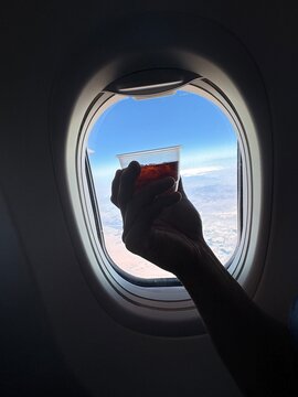 Enjoying a beverage on a flight