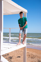 A young attractive man is relaxing by the sea.