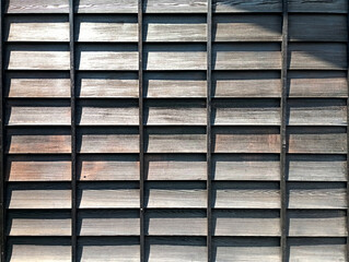 Cypress wood wall, wooden frame wall, cypress wood building, Japanese style dormitory, used as background or texture (photographed deliberately at noon time. High light contrast)