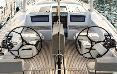 Watercraft with dual steering wheels on its deck for naval architecture