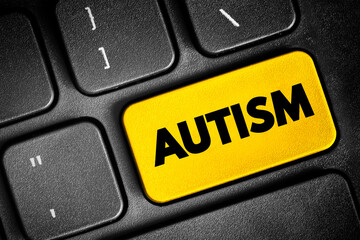 Autism - neurodevelopmental disorder characterized by difficulties with social interaction and communication, text button on keyboard, concept background