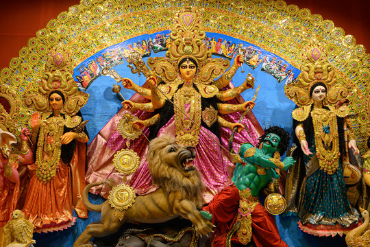 Idol of Goddess Devi Durga at a decorated puja pandal in Kolkata, West Bengal, India. Durga Puja is a famous and major religious festival of Hinduism that is celebrated throughout the world.