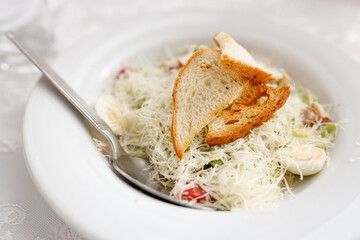 Caesar salad with cheese and croutons