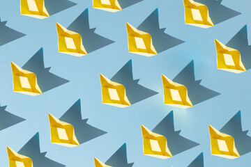 yellow paper boats on blue background