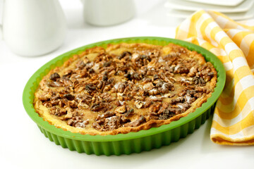 Vanilla custard tart with walnuts.