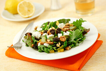 Mixed salad with cheese and walnuts.