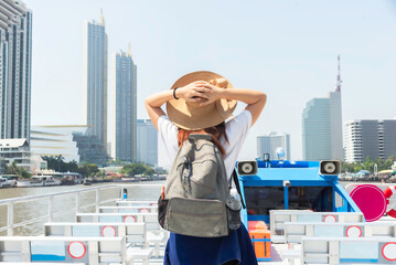 Young women cruise on the Chao Phraya River,tourist female on holiday vacation trips, Tourism...
