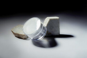 still life of cosmetic cream with marble lights and reflections