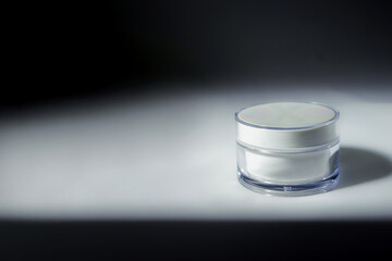 cosmetic cream on a background with shadows and copyspace