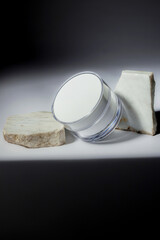 still life of cosmetic cream with marble