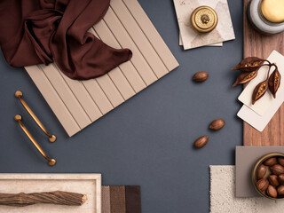 Creative flat lay composition with textile and paint samples, panels and cement tiles. Stylish interior designer moodboard. Blue, beige and brown color palette. Copy space. Template.