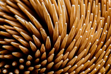 Naklejka na ściany i meble Abstract background Close-up. Bamboo toothpicks swirl. Bamboo toothpicks texture, macro.