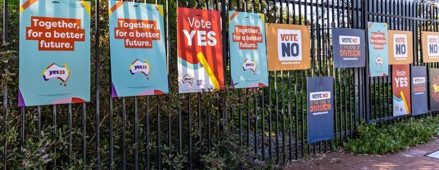 Voting posters outside a polling place for the Australian referendum to The Voice.