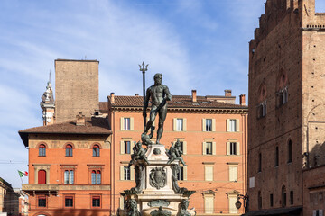 Neptune Fountain commands attention in Bologna, its statue set against historic buildings and a...
