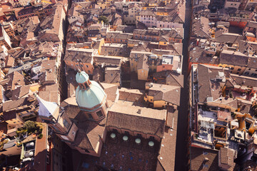An aerial view of Bologna historic city center, highlighting the domes of the Church of Saints...