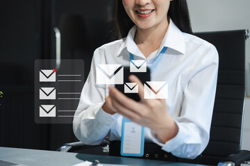 Email notification concept, Female use smartphone and laptop receive message alert in the mailbox.