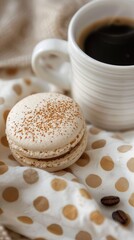 A delicate macaron with a coffee powder dusting, placed on an elegant white plate and set against the backdrop tablecloth with a steaming cup of black or latte espresso, - 795082841