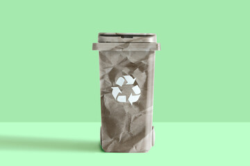 Paper garbage bin on studio green  background
