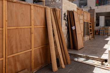 A street scene in Jerusalem during Sukkot, in which temporary, wooden or fabric structures called a...
