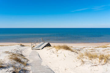 A wooden walking path leading to the stairs to the beach on the Curonian Spit on the Baltic Sea, Lithuania