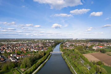 River flowing through a green landscape with houses and trees seen from above Mittellandkanal Hanover