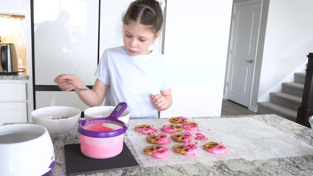 Young Chef Prepares Chocolate-Covered Treats in Sunny Kitchen