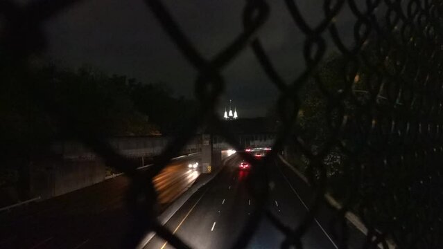 Washington DC USA Traffic on the Interstate 495 Beltway at night and the Washington D.C. Temple, or Mormon Temple. 