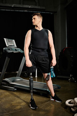 Fototapeta na wymiar A disabled man with a prosthetic leg stands on a treadmill in a gym, determined and focused on his workout routine.