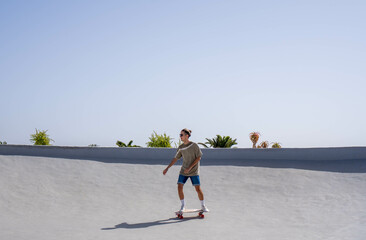 Young Man Skateboarding With a Surfskate on a Sunny Day