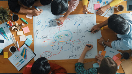 Group of business people writing and making mind map to brainstorming marketing idea at meeting....