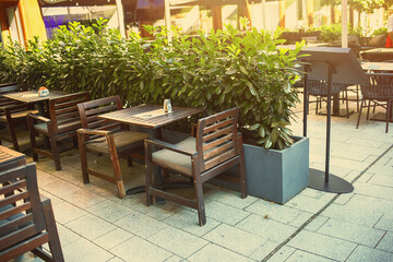 Fototapeta na wymiar Restaurant outdoor terrace in city centre.Summer season