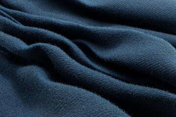 Blue wool fabric cloth with loose threads and detailed texture. Illustration as background and wallpaper for web designs and slide show presentations