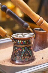 top view of making traditional turkish coffee on sand 