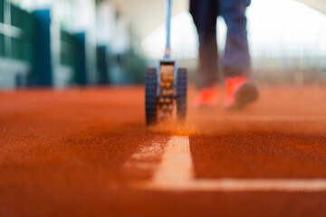 line brushing to make the line more visible in clay tennis court