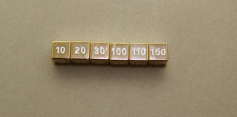 Golden dice with numbers. Game dice.
