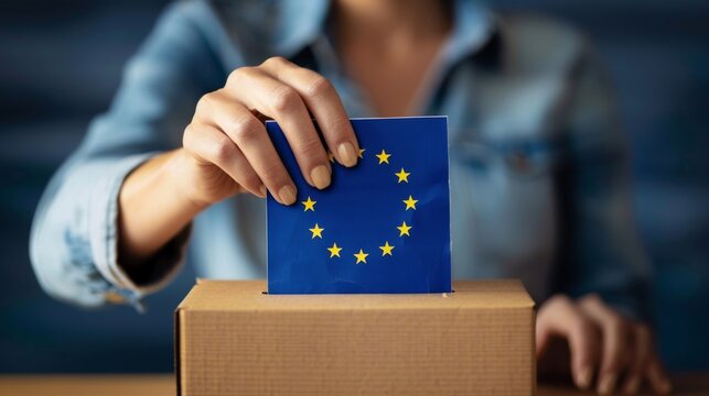 EU concept background European elections in Germany / June 9, 2024, woman throws ballot paper with European flag into the ballot box